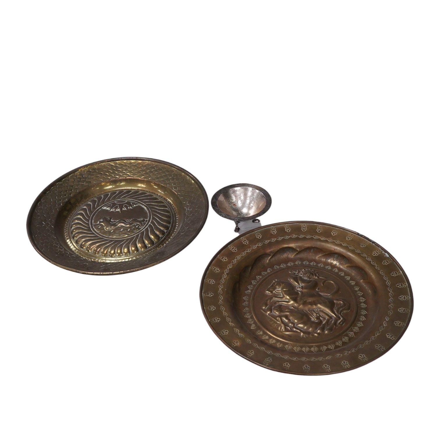 Two Nuremberg style embossed brass alms dishes and a Dresser style silver plated three footed bowl, brass dishes 36cm diameter. Condition - good